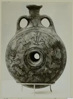 White Painted IV-V vessel: round flattened body with two loop handles and dark painted decoration, on a metal stand