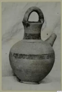 Pottery White Painted III-1 vessel from Lapithos, Kastros tombs: a jug with a loop handle and side spout, painted bands