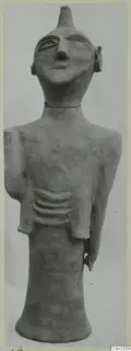 Terracotta figurine of a standing human figure with a conical head-top, a long neck and a pronounced nose.