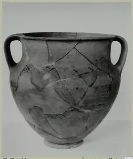 Two-handled amphora-crater from Enkomi, reconstructed from fragments and shown against a plain grey backdrop