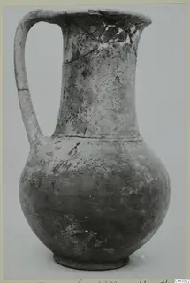 Pottery jug with a tall neck, single loop handle and rounded body, from Milia