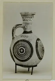 Pottery White Painted IV: a one-handled jug with concentric circles painted on its body