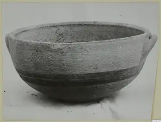 Pottery bowl, White Painted IV, from Amathus, photographed on a plain surface