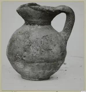 Pottery juglet, White Painted IV, with a rounded body and strap handle