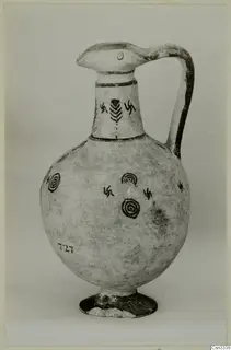 Pottery White Painted IV: a jug with a beak-like spout, strap handle and dark painted circles and hooked crosses