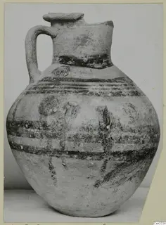 Painted pottery vessel with one handle and dark bands, from Marion