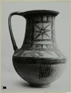 Wheel-made bichrome pottery jug with a star motif in a panel on the neck
