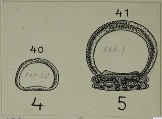 Field drawing of two rings, one small and one large with a decorated flat base, in ink on a card.