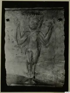 Thin metal sheet with a raised relief of a standing human figure with arms raised, from Lapithos
