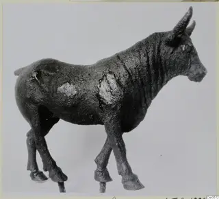Bronze figure of a standing horned animal in side view