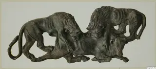 Bronze openwork plaque showing two lions attacking a third animal beneath them