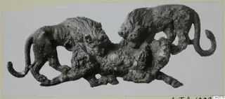 Bronze openwork sculpture of two lions attacking a bull