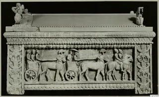 Stone sarcophagus with a relief frieze of chariots and horsemen