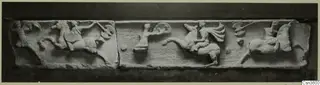 Carved relief frieze in pale stone showing horse riders and a disc, photographed as two slabs