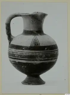 Pottery Bichrome I jug from Lapithos, with a strap handle, banded body and hatched triangle motif