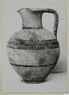 Pottery Bichrome II jug with a strap handle and dark painted bands