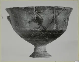Pottery Bichrome III: a footed bowl with a flaring rim and dark painted bands on the body.