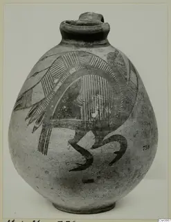 Globular pottery jug with dark hatched panels and curving painted motifs on its body.