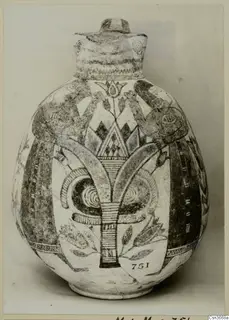 Painted Bichrome IV jug with a central stylised plant motif, spirals and banded decoration.