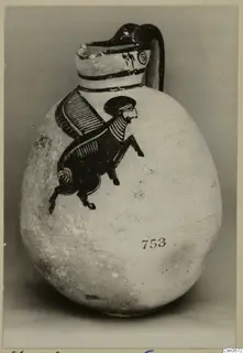 Bichrome IV jug with a black painted winged creature in profile on its pale body