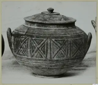 Pottery vessel with a domed lid, two side handles and a band of triangular patterns