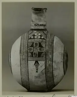 Round-bodied jug with black painted bands and geometric panels