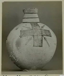 Pottery Bichrome IV jug with banded neck and cross-shaped painted panels on a round body