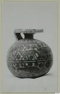 Round-bodied painted pottery vessel with a flat collar rim and two small handles, photographed on a plain background