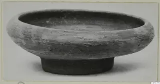 Pottery Stroke Polished Ware bowl with a wide rim and low ring base, shown from the side
