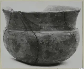 Pottery Stroke Polished Ware bowl from Marion, with a dark burnished surface, a flared rim and a broken lug