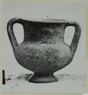 Grey polished ware vessel with two handles and a pedestal foot, from the Lapithos Kastros tombs