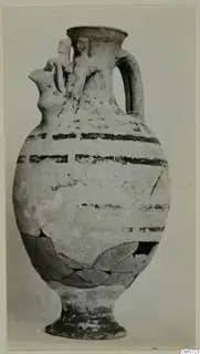 Jug from Marion with two modelled figures at the neck and black painted bands on the body