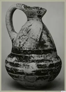 Bichrome V jug with a single handle and dark painted bands around its body