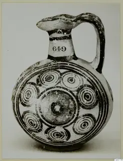 Painted jug with concentric circle motifs on its body and a number label on the neck