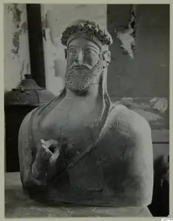 Bust of a bearded figure wearing a wreath, terracotta, from Mersinaki