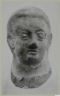 Head sculpture from Mersinaki, shown frontally with wide eyes, a broad nose and a short hairline