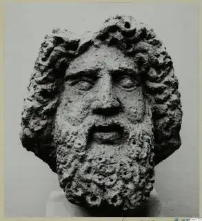 Bearded head in stone from Soli, seen from the front