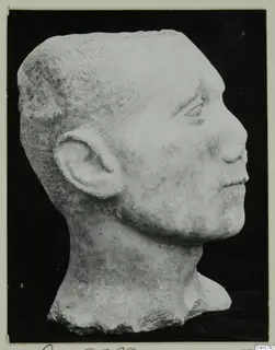 Roman sculpture: carved stone head of a man in profile, facing right