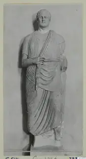 Standing draped stone statue of a male figure, from the Hellenistic and Roman sculpture series.