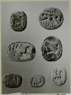 Seven engraved seals or gems, including a chariot with a horse and driver, arranged in rows on a grey background.