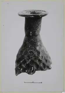 Blown glass vessel with a flared rim, narrow neck and lower body with a dimpled, weathered surface