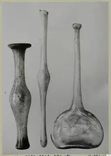 Three blown glass vessels of differing forms, standing side by side.