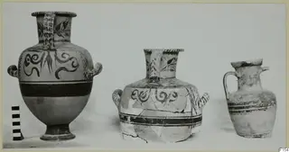 Three painted pottery vessels in a row, with a striped scale bar at the left edge.