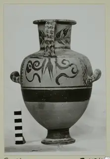 Painted pottery jar with scroll and leaf decoration, photographed beside a scale bar; Cyprus Museum