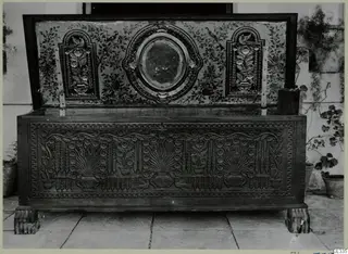 Carved wooden clothes chest, called sendudzin, with its lid open to show a painted inner lid