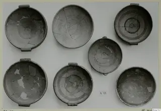 Seven handled bowls from Amathus, several with concentric painted bands, photographed from above.