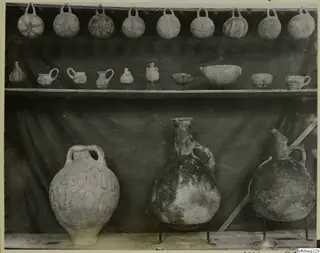 Pots with a pattern from Cyprus, arranged on wooden shelves in the Cyprus Museum