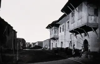 Larnaca: a street of houses with timber balconies, 1981 contact print