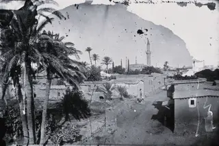 Nicosia: a road between low houses, 1981 contact print