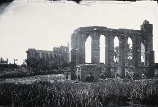 Famagusta: ruined churches beyond a field of crops, 1981 contact print